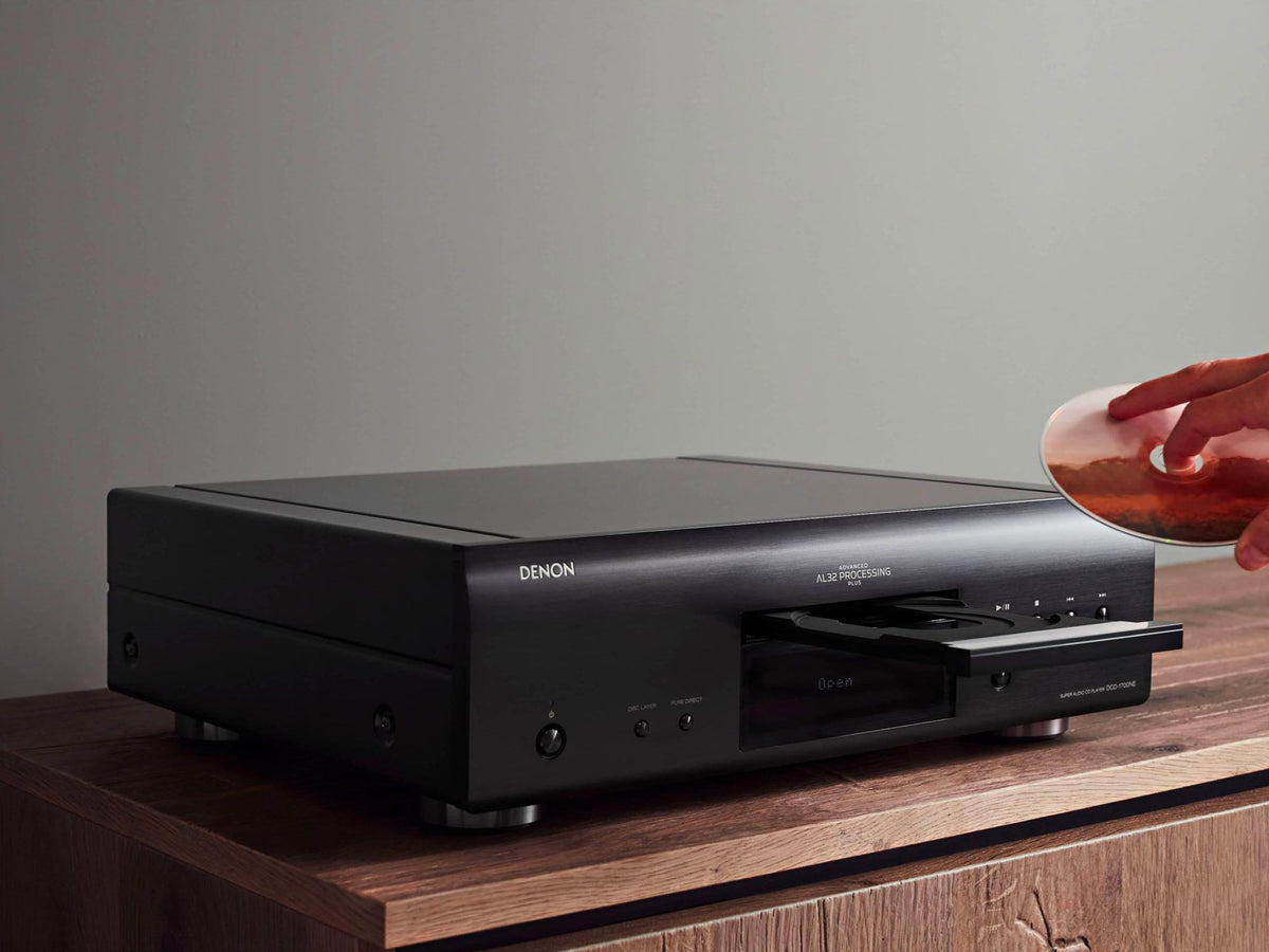 Denon DCD-1700NE CD/SACD player: placing a disc in the black player open tray