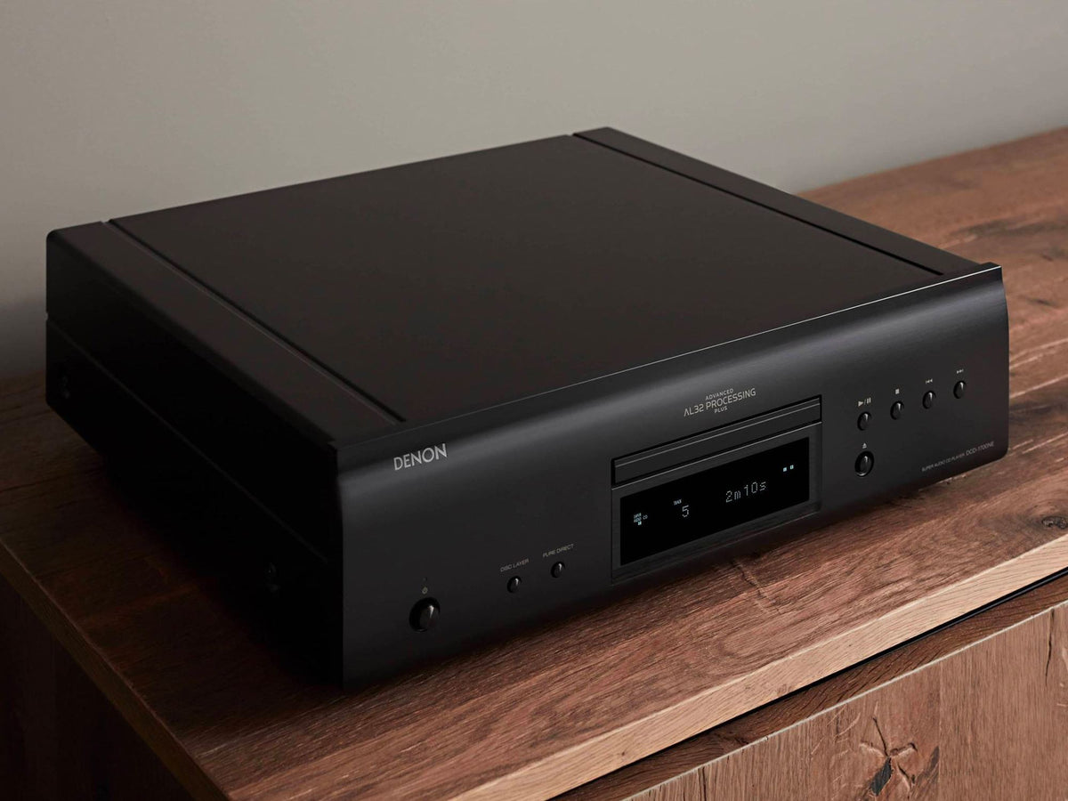 Denon DCD-1700NE CD/SACD player: black player on a cabinet, top angled view