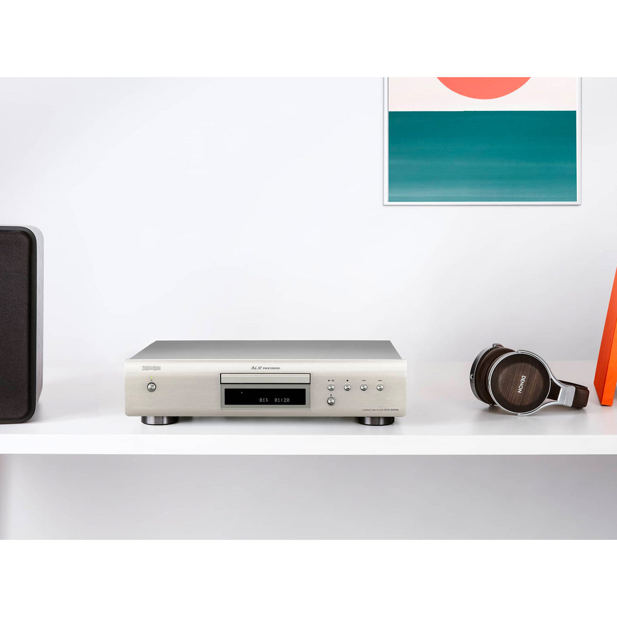 Denon DCD-600NE Premium Silver CD player on a shelf