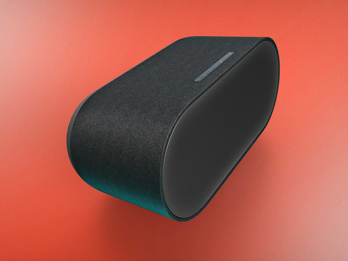 Denon Home 600 belaidė garso kolonėlė, antracito pilka, valdymo pusės vaizdas spalvotame fone