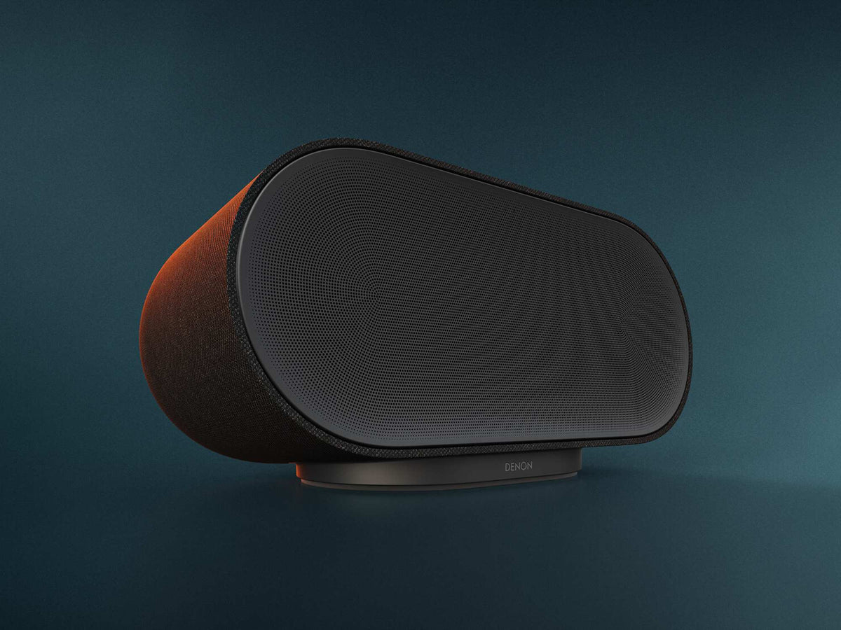 Denon Home 600 belaidė garso kolonėlė, antracito pilka, priekinės dalies vaizdas spalvotame fone