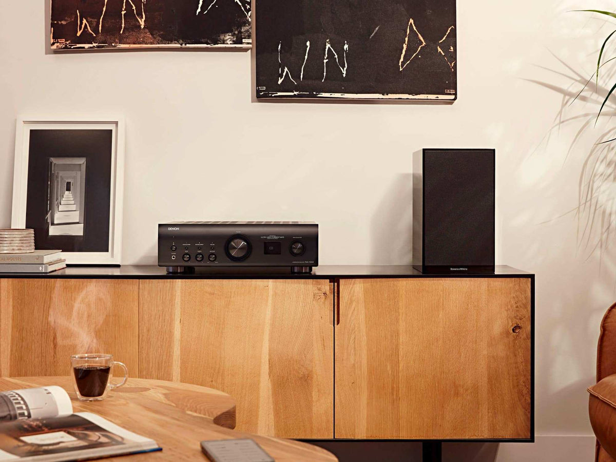 Denon PMA-1700NE black integrated amplifier, in a home stereo system