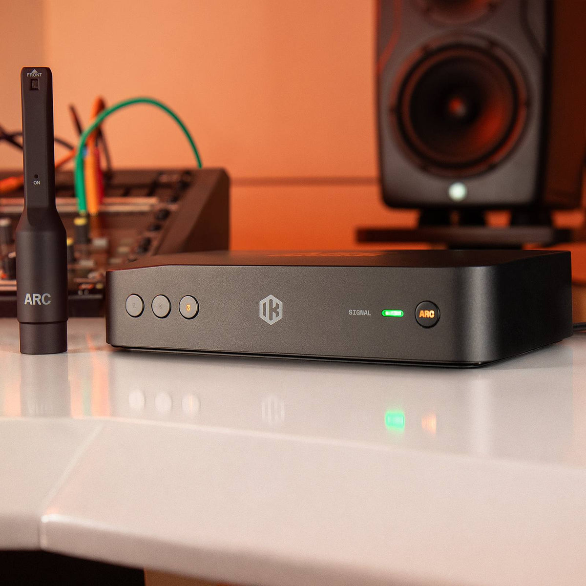 IK Multimedia ARC STUDIO+ Room Correction System and measurement microphone in a studio