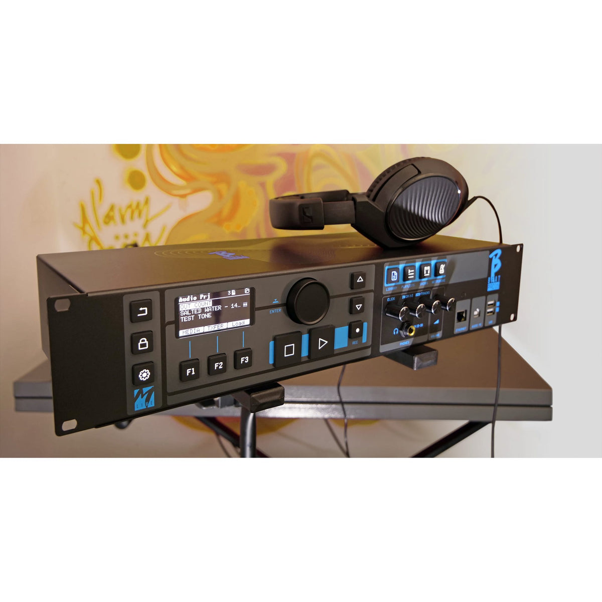 M-Live B.Beat PRO16 Plus 1 TB Wi-Fi Audio and Video Player, player and headphones on a stand