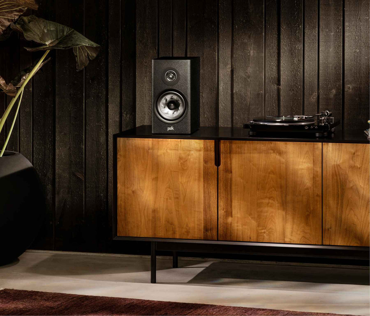 Polk Audio Reserve R200 black bookshelf speaker, in a room