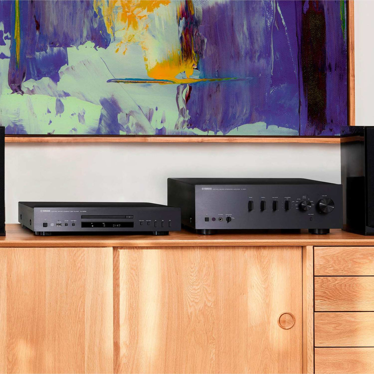 Yamaha CD-S303 CD Player, in a home stereo system on a cabinet